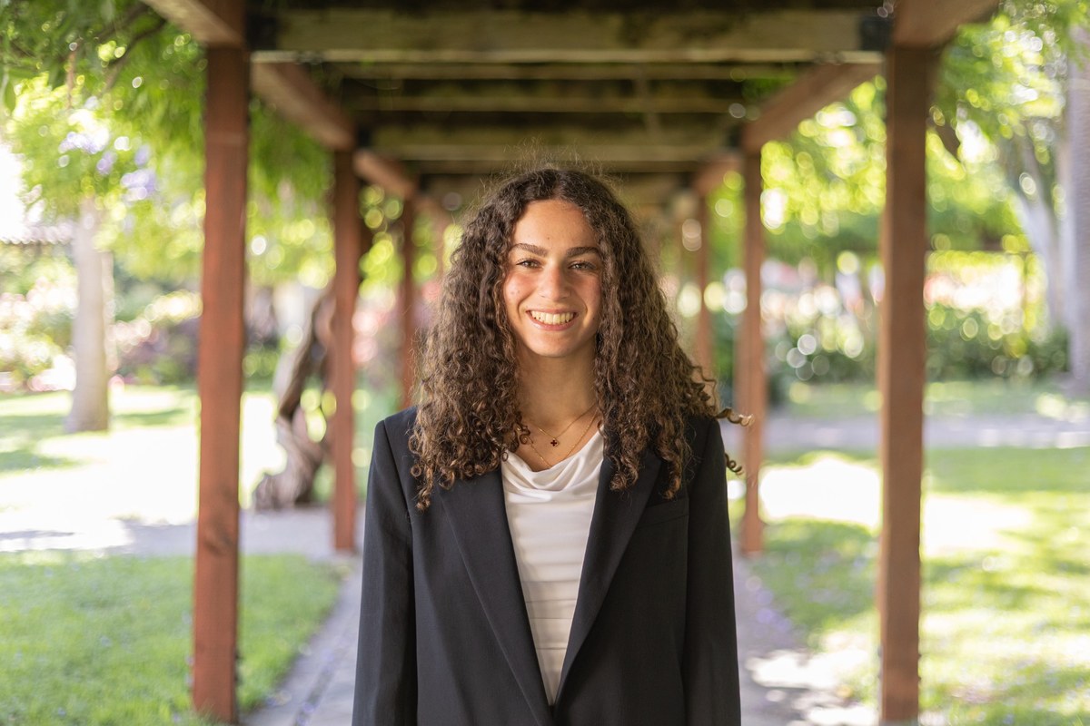 Portrait of Norah Mehanna outdoors.